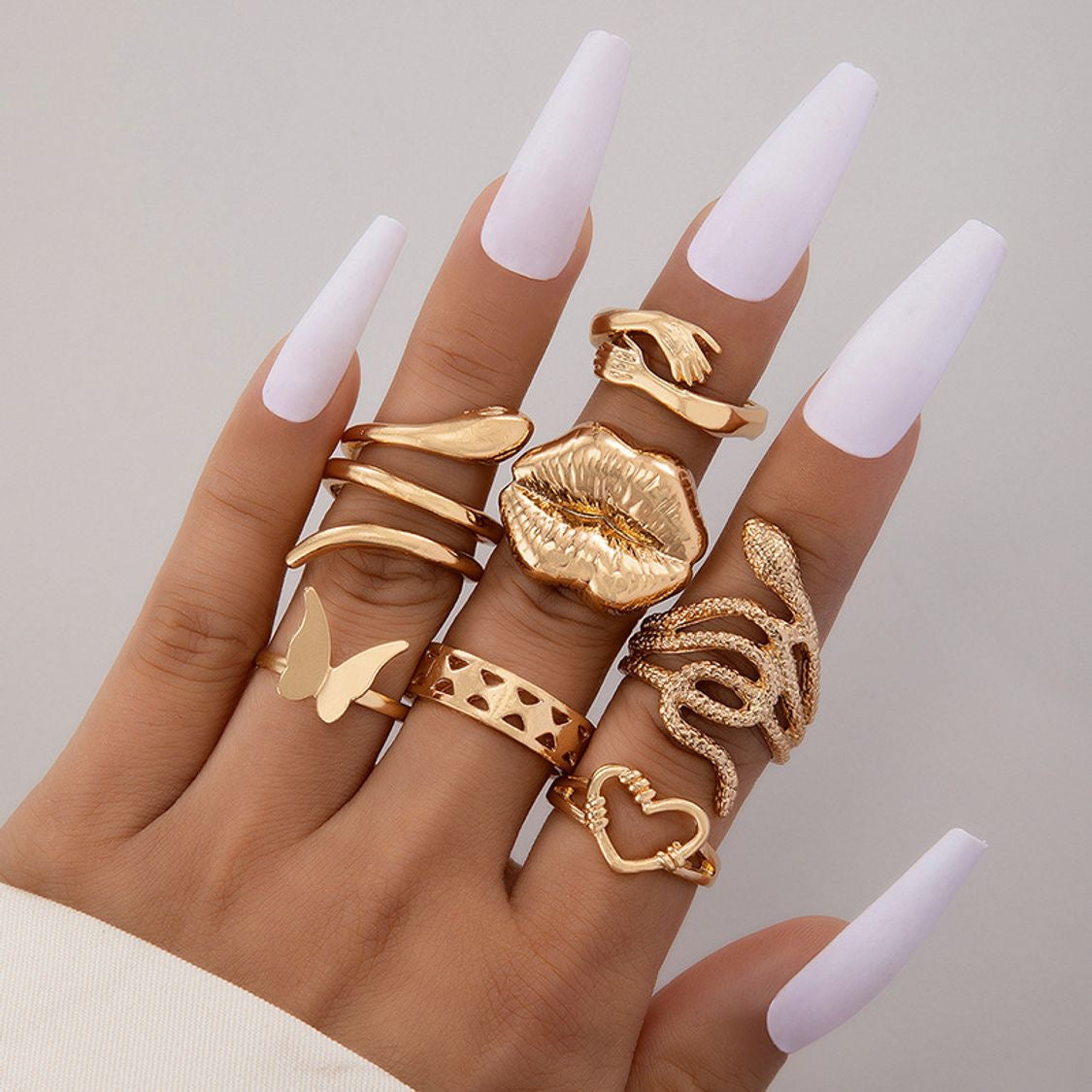 Anillos set dorado 8 pzs beso(H112)